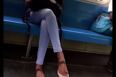 Young girl crossed legs in the train