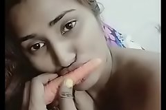 Cute Sexy Indian girl is playing round carrot