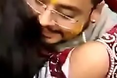 Cute Indian bride kissing publicly