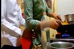 indian new married couple romance in kitchen