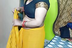 Indian Beautiful Bhabhi about Yellow Color Sari.