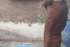 My relative's housewife is taking bath in the open bathroom wearing black underwear at my house