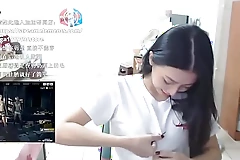 A playful Japanese camgirl teases her flawless curves with thrilling flashes on stream.